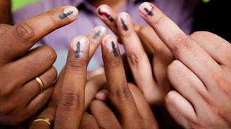 Hands with voter ink marks