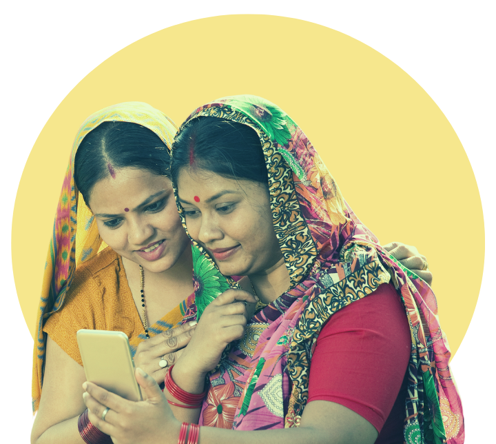 Two Indian women looking at a mobile phone